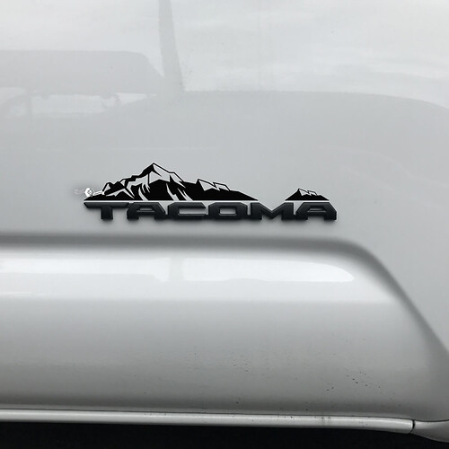 Toyota Tacoma Mountains Decal Sticker Over Badge
